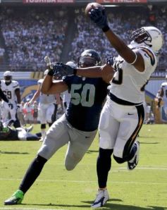 Antonio Gates catches a TD pass over K.J. Wright in the second half (AP)