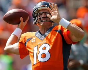 Peyton Manning warms up before the Broncos' 24-17 win over Kansas City on Sunday (AP)