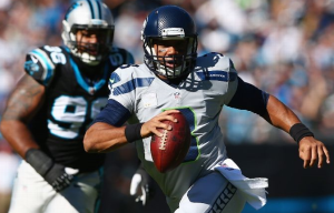 Russell Wilson runs against Carolina on Sunday (Getty)