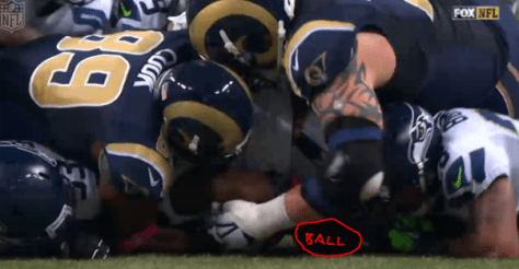 The ball settles under Richard Sherman in a pile on the last play of the Seahawks-Rams game (via FOX)