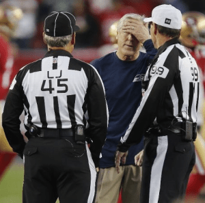 Pete Carroll talks with line judge Jeff Seeman and referee Tony Corrente before Seattle's game at Levi's Stadium in Santa Clara, Calif. (Getty)