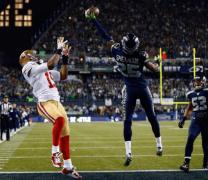 Richard Sherman tips a pass intended for Michael Crabtree in the NFC Championship Game last season (Getty)