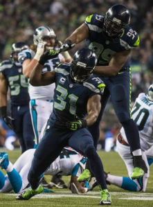 Kam Chancellor and Tony McDaniel celebrate a stop vs. Carolina on Saturday (Seahawks.com)