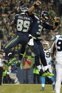 Russell Wilson and Doug Baldwin celebrate a 16-yard TD hookup vs. Carolina (Seahawks.com)