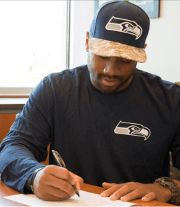 Wilson signing contract